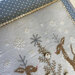 A super close up of the design showing the details of the snowflakes and embellishments on the tree.