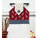 A close up shot of the top of the hanging towel. A shield and olive branch can be seen in the red fabric.