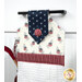 A close up on the top of the towel, demonstrating fabric colors and button closure detail.