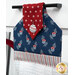 A close up on the top of the towel, demonstrating fabric colors and button closure detail.