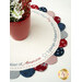 A stylized shot of the completed table topper displayed on a white table with coordinating decor. 
