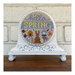 The completed Hello Spring cross stitch project, displayed on a coordinating cross stitch display stand.
