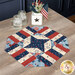 The completed Easy Patriotic Table Topper Kits finished in American themed fabrics from the Founding Glory collection by Wilmington Prints, set on a wooden table and surrounded by coordinating décor.