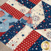 A close up on the detailed patchwork on the American themed table topper. 