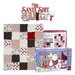 A quilting kit featuring a colorful patchwork design and a box labeled The Santa Quilt Kit.