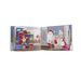 The Santa Suit Quilt storybook, opened to a page featuring Santa and Mrs. Claus.