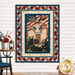 The completed Ribbon Border Panel Quilt, with a center panel that features the Founding Fathers signing the Declaration of Independence surrounded by patriotic fabrics from the America 250 - Stonehenge collection by Northcott Fabrics, hung on a white paneled wall. A gold Shabby Fabrics logo is in the bottom corner.
