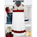 The completed Hanging Towel Kit colored in red, white, and blue fabrics from the American 250 - Stonehenge collection by Northcott Fabrics, hung on a drawer surrounded by coordinating patriotic décor. 