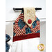 A close up on the top of the towel, demonstrating fabric colors and button closure detail.