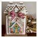 The completed cross stitch project, staged on a distressed wooden table.