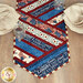 A close up on one end of the runner, showing details on the patriotic fabrics, staged with coordinating table settings and glass jars.