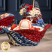 A close up on one of the bowl cozies holding a bowl of ice cream, staged with the other bowl cozies and coordinating patriotic décor.