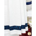 A close up on the bottom of the towel, showing details on the fabric stripe.