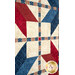 An angled close up on the quilt, demonstrating fabric prints and color details as well as top quilting effects.
