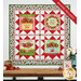 The completed Double Geese Wall Hanging, colored in aqua, green, white, and red fabrics from the Berry Besties collection by Henry Glass Fabrics, hung on a white paneled wall and staged with coordinating flowers and décor.