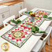The completed Double Geese Table Runner, staged on a white kitchen table with coordinating table settings at each chair.