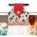 A close up on the top of the towel, showing print details on the top, loop, and fabric button.