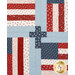 A close up on quilt, demonstrating details on the flag and cross patchwork.