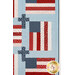 A close up on quilt, demonstrating details on the flag and cross patchwork.