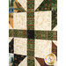 A super close up on the patchwork of the quilt, showing fabric print and color details.