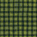 An 8x8 swatch of the fabric featuring an abstract woven plaid pattern in citrine and teal blue hues on a black background.
