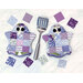 Two of the ghostly hot pads in fabrics from the Hydrangeas in the Garden collection, staged with a spatula.