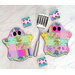 Two of the ghostly hot pads in fabrics from the Floral Reef collection, staged with a spatula.