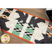 A close up on the patchwork of the runner, demonstrating fabric color and print details.