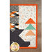 A close up on the patchwork of the runner, demonstrating fabric color and print details.