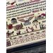 Close up on the cross-stitch artwork featuring historical motifs, patriotic themes, and text celebrating America's heritage.