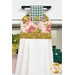 A close up shot of the top of the hanging towel, showing details on the floral prints and fabric button.