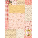 A close up on the patchwork of the quilt, demonstrating fabric color and print details as well as top quilting effects.