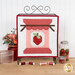 The completed A Year in Spools - June - Sew Jammy Kit, colored in white, red, and pink fabrics, staged on a display stand with coordinating décor.