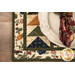 A close up of the corner of the placemat, demonstrating the flying geese patchwork. 