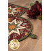 A close up of the edge of the round hot pad, showing the binding as well as the fabric loop.
