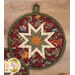 A super close up on the center of the round hot pad, demonstrating the red fabric details on the beautiful folded star center.