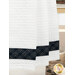 A close up on the bottom of the towel, showing details on the fabric stripe.