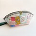 A shot of one of the small pouches, colored in calico prints.