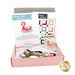 A shot of the open June Needle Minder box, showing the contents of pattern, floss, chart, and flamingo needle minder.