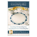Image of a scalloped table topper design titled Something Blue, featuring a central plain area and blue accents. Includes an iron-on transfer.