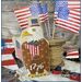 The completed 1776 eagle finished as a pillow, staged with American flags and 1776, surrounded by craft materials