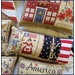 A close up on one of the projects, showcasing a colonial couple holding an American flag.