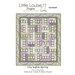 Pattern cover for City Lights Spring quilt featuring geometric blocks in lavender and green.