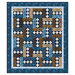 The City Lights quilt colored in blues, browns, and cream textured fabrics.
