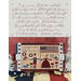 finished cross stitch project featuring quakers, a 1776 flag, florals, and a dog with the text "long may she wave" with cursive script above