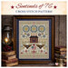 Image of the completed cross stitch project, framed and staged with decor.
