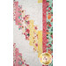A closer look at the patchwork of the quilt, showing fabric and layout details.