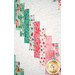 A close up on the patchwork of the quilt, demonstrating fabric colors and print details.