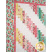 A closer look at the patchwork of the quilt, showing fabric and layout details.
