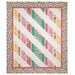 The completed 28th Floor Quilt colored in rich pink, aqua, chiffon yellow, and white fabrics from the Peony Blossoms collection by Wilmington Prints, isolated on a white background. 